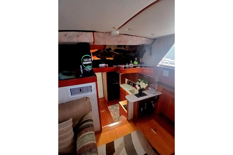 Slide: The Image of Interior of a 1976 Viking 40 Sedan Diesel yacht with cozy seating and wooden cabinetry. - 3
