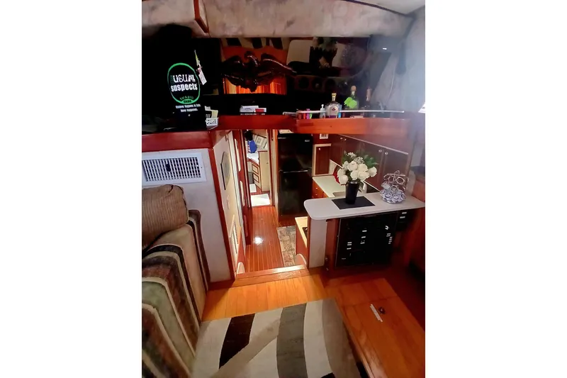 Slide: The Image of Interior of a 1976 Viking 40 Sedan Diesel yacht, featuring cozy seating and elegant decor. - 5