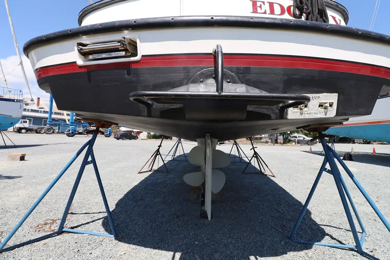 Slide: The Image of 2007 Nordic Tug 32 boat on stands, showcasing hull and propeller. - 22