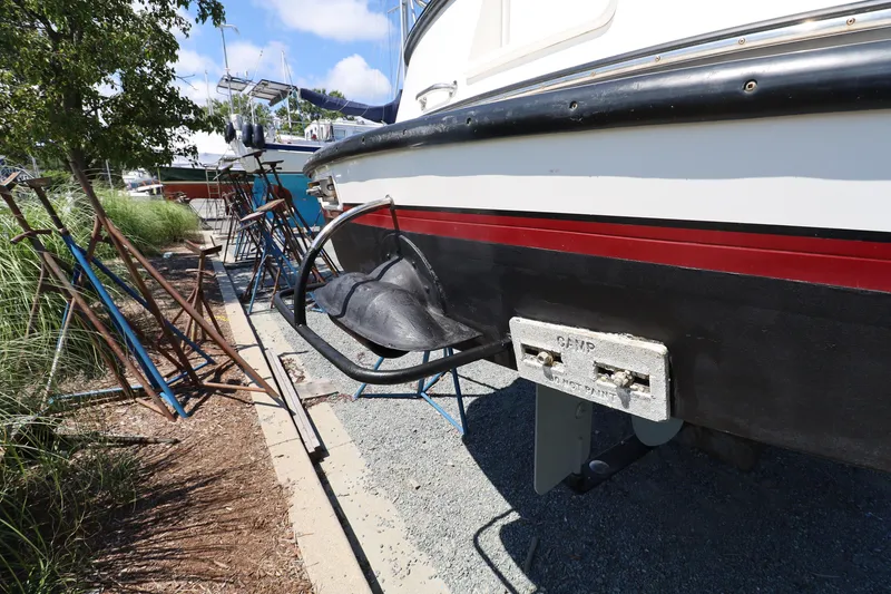 Slide: The Image of 2007 Nordic Tug 32 boat on dry dock, showing hull and propeller area. - 23