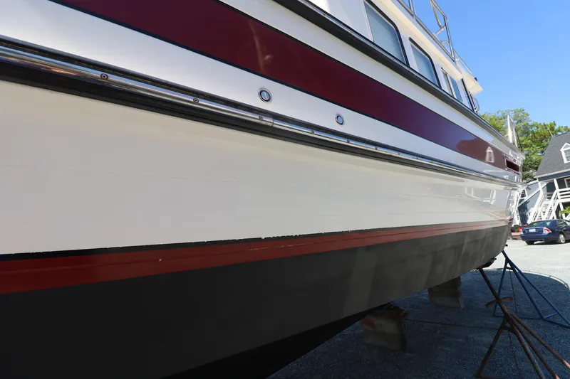 Slide: The Image of 2007 Nordic Tug 32 boat on dry dock, showcasing hull and exterior design. - 24
