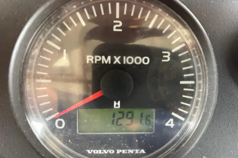 Slide: The Image of Volvo Penta tachometer displaying 1291.6 RPM on a 2007 Nordic Tug 32. - 30
