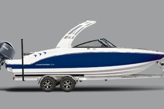 The Image of 2025 Chaparral 23 SSi OB boat on trailer, blue and white design, side view. - 0