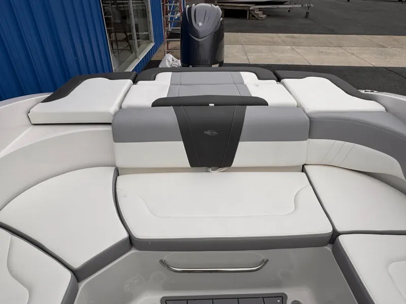 Slide: The Image of 2025 Chaparral 23 SSi OB boat interior with cushioned seating and sleek design. - 12