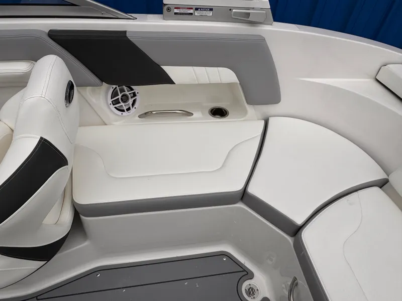 Slide: The Image of Interior seating of 2025 Chaparral 23 SSi OB boat, featuring white and gray upholstery. - 16