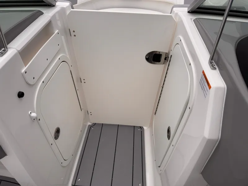 Slide: The Image of Interior view of 2025 Chaparral 23 SSi OB boat, featuring storage compartments and sleek design. - 25