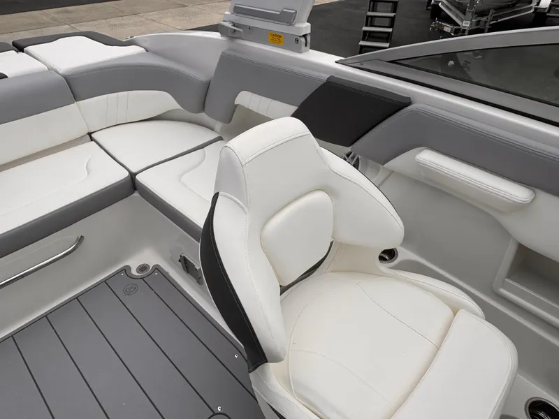 Slide: The Image of 2025 Chaparral 23 SSi OB boat interior with white and gray seating. - 7