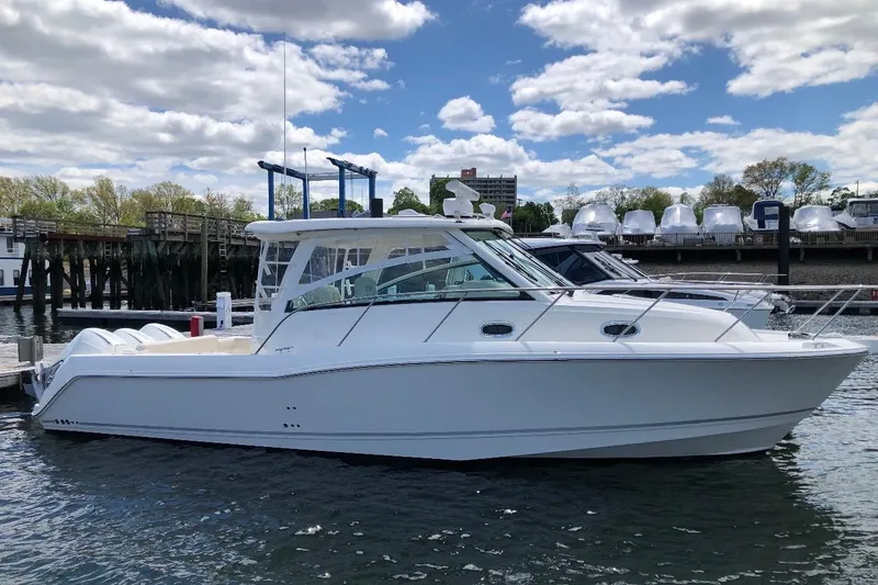The Image of 2020 Boston Whaler 345 Conquest boat docked on a sunny day. - 1