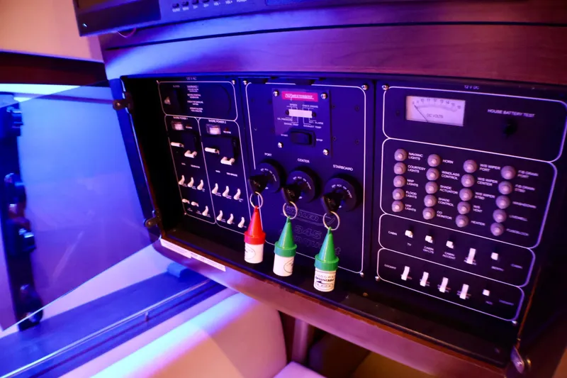Slide: The Image of Electrical control panel of a 2020 Boston Whaler 345 Conquest boat, featuring switches and indicators. - 12