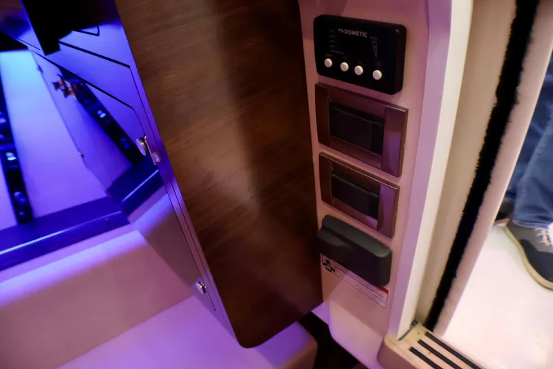 Slide: The Image of Interior controls of a 2020 Boston Whaler 345 Conquest boat, featuring modern panel design. - 15