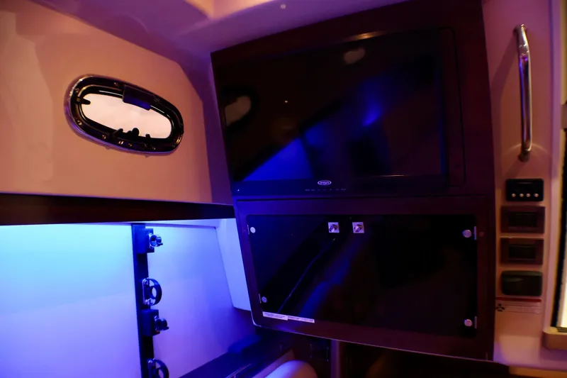 Slide: The Image of Interior of 2020 Boston Whaler 345 Conquest with ambient blue lighting and modern amenities. - 20