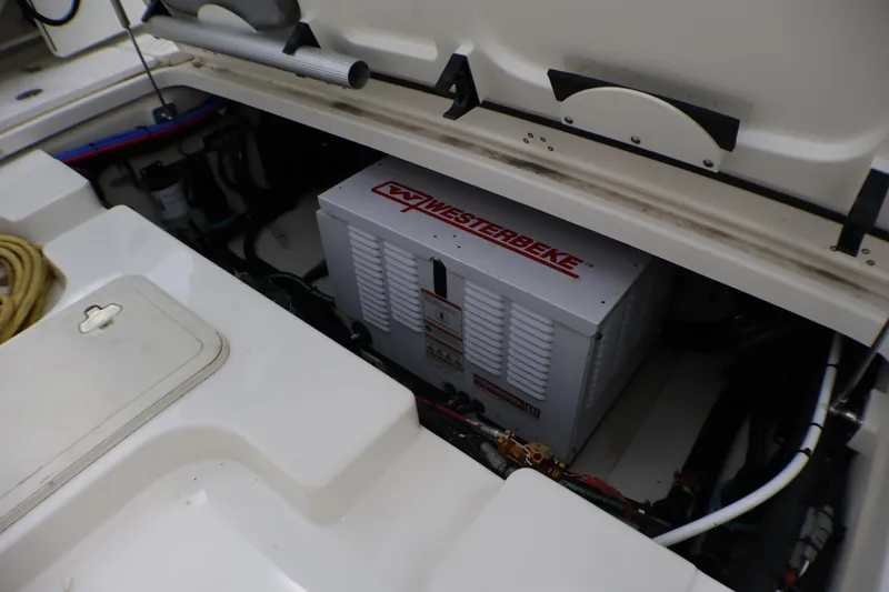 Slide: The Image of Engine compartment of a 2020 Boston Whaler 345 Conquest with Westerbeke generator. - 21