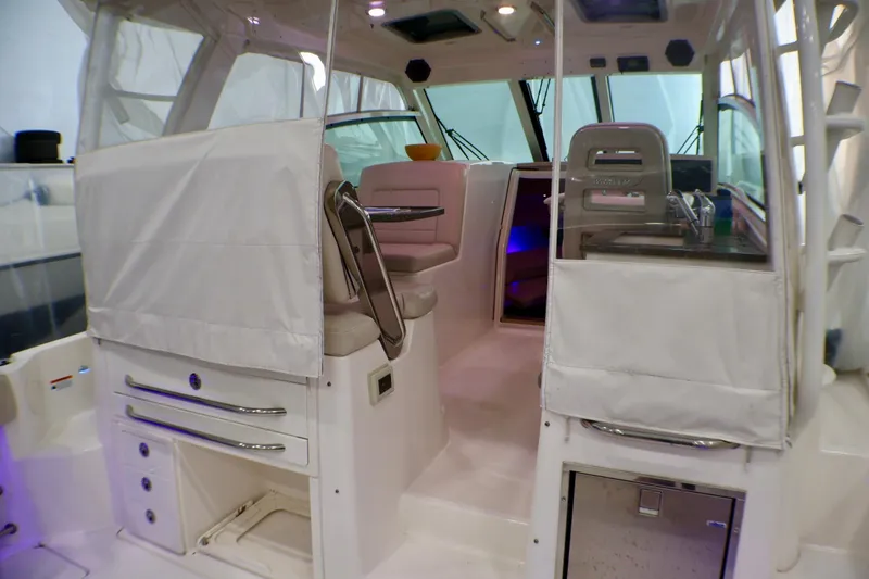 Slide: The Image of Interior view of a 2020 Boston Whaler 345 Conquest boat, featuring seating and storage. - 4
