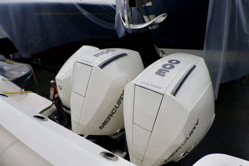 Slide: The Image of Triple Mercury outboard engines on a 2020 Boston Whaler 345 Conquest boat. - 6