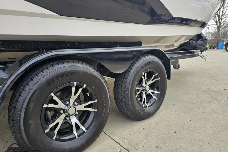 Slide: The Image of Trailer with Atturo tires for 2013 MasterCraft X-10 boat on concrete surface. - 13