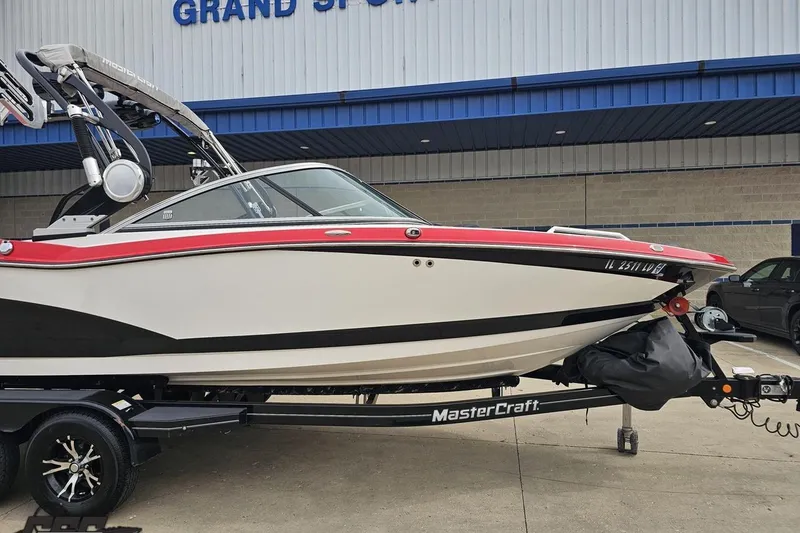 Slide: The Image of 2013 MasterCraft X-10 boat on trailer outside Grand Sport Center. - 15