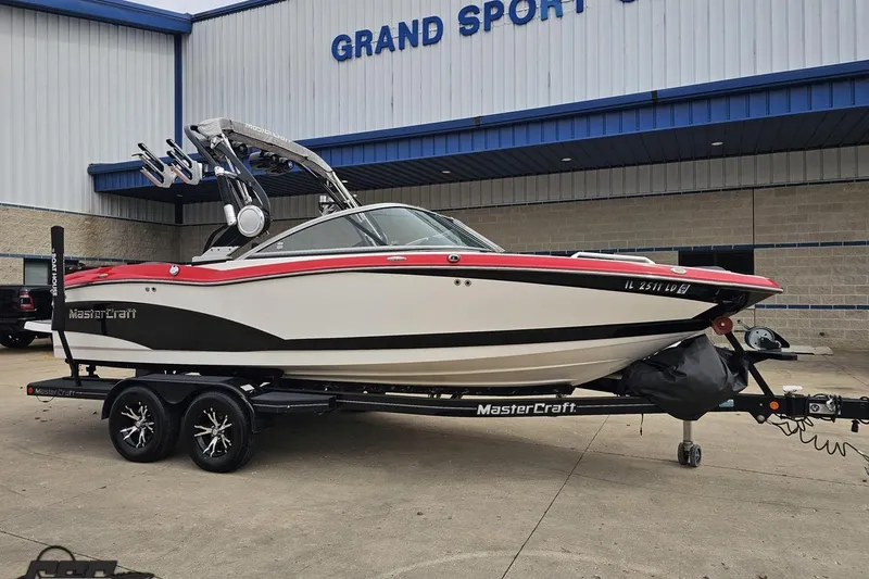 Slide: The Image of 2013 MasterCraft X-10 boat on trailer outside Grand Sport Center. - 16