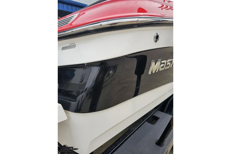 Slide: The Image of 2013 MasterCraft X-10 boat with red and white exterior detailing. - 40