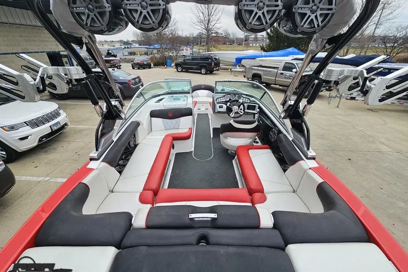 Slide: The Image of 2013 MasterCraft X-10 boat interior with red and white seating, JL Audio speakers. - 44