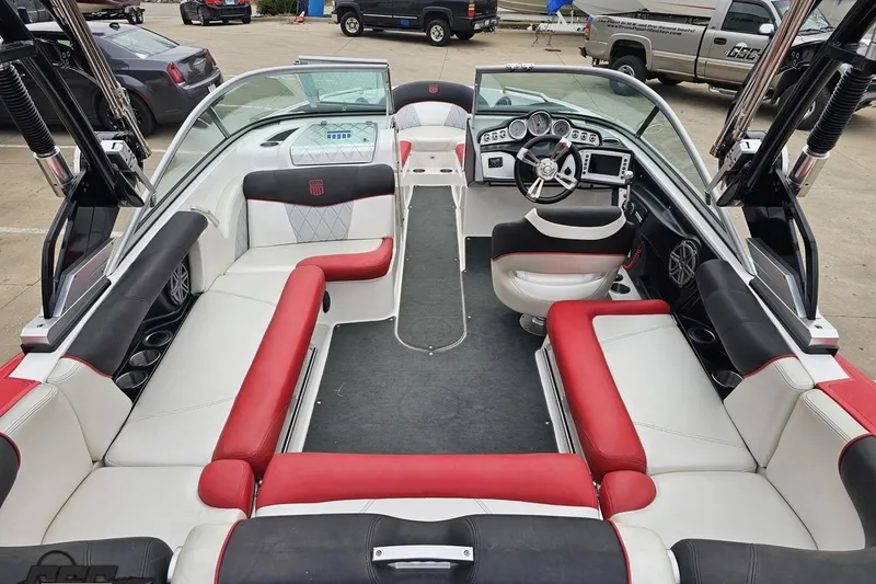 Slide: The Image of Interior of a 2013 MasterCraft X-10 boat with red and white seating. - 46