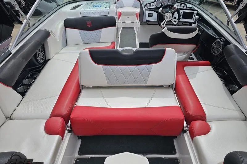 Slide: The Image of Interior of a 2013 MasterCraft X-10 boat with red and white seating. - 49