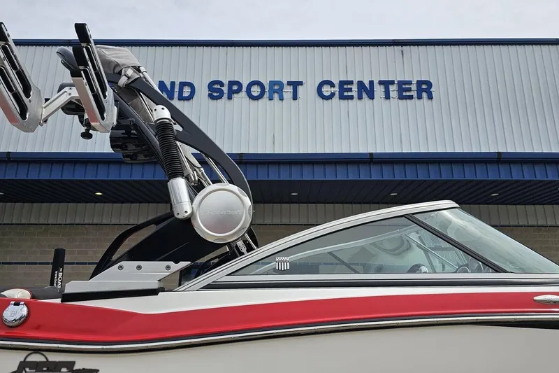Slide: The Image of 2013 MasterCraft X-10 boat at a sports center, featuring sleek design and vibrant colors. - 5