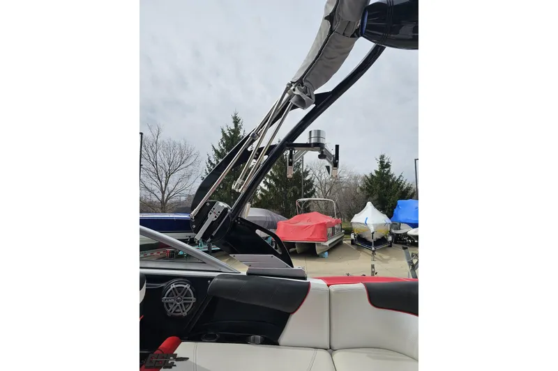 Slide: The Image of 2013 MasterCraft X-10 boat interior with tower, parked outdoors. - 52