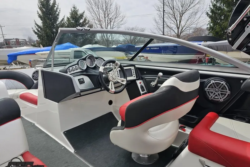 Slide: The Image of Interior of a 2013 MasterCraft X-10 boat with modern dashboard and seating. - 53