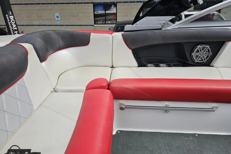 Slide: The Image of Interior of 2013 MasterCraft X-10 boat with red and white seating. - 54