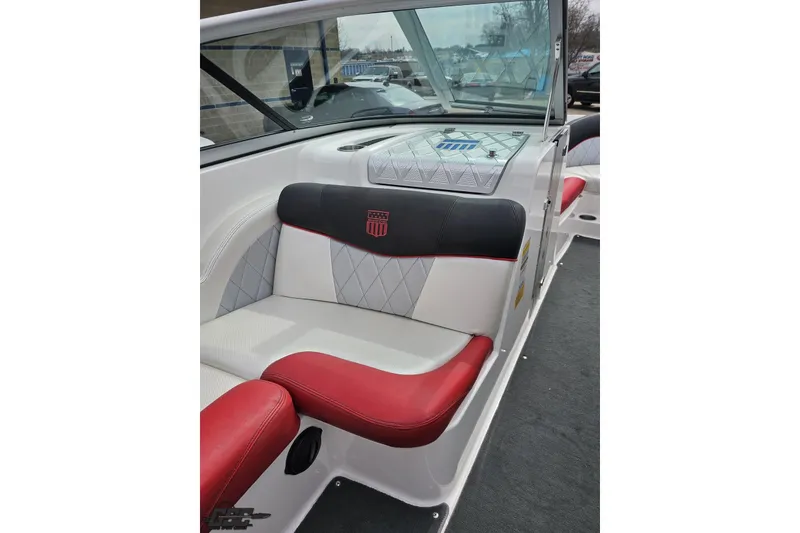Slide: The Image of 2013 MasterCraft X-10 boat interior with red and white seating, diamond pattern upholstery. - 56