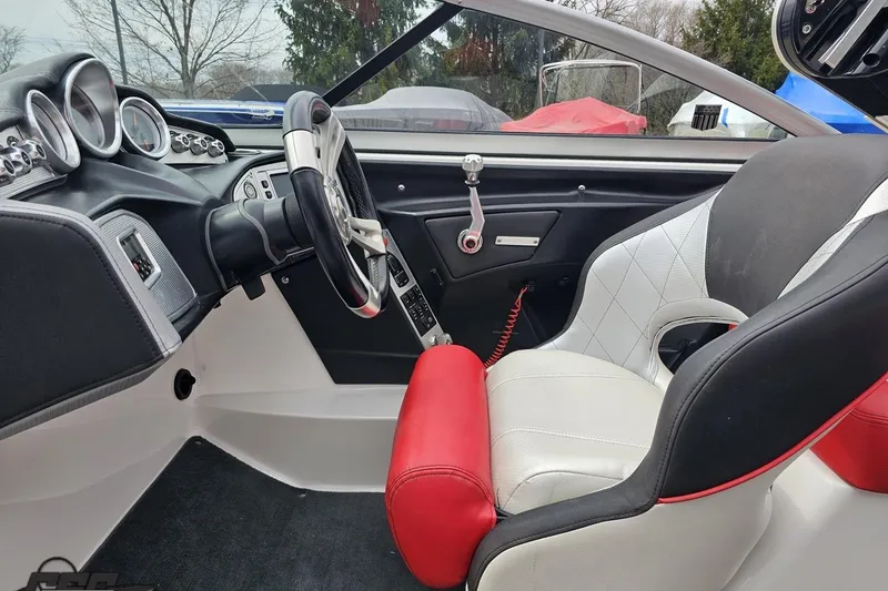 Slide: The Image of Interior of a 2013 MasterCraft X-10 boat with modern dashboard and seating. - 61