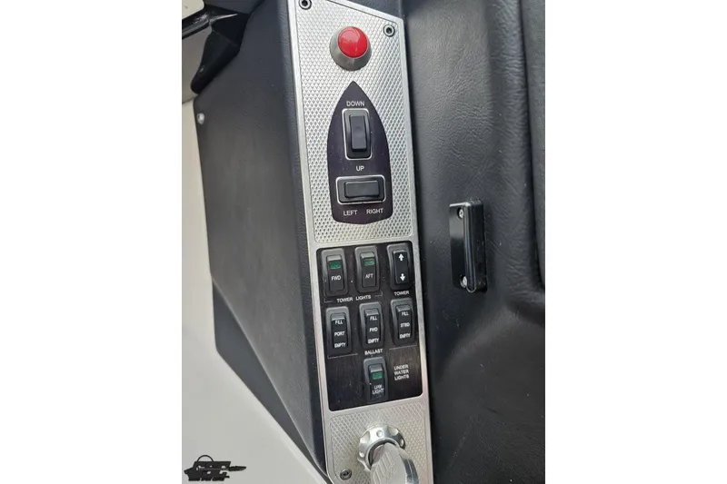 Slide: The Image of Control panel of a 2013 MasterCraft X-10 boat with various switches and buttons. - 66