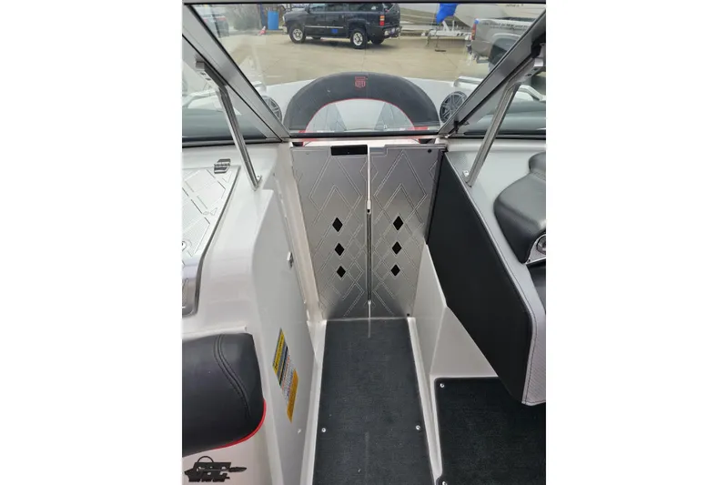 Slide: The Image of Interior view of a 2013 MasterCraft X-10 boat, featuring sleek seating and modern design. - 72