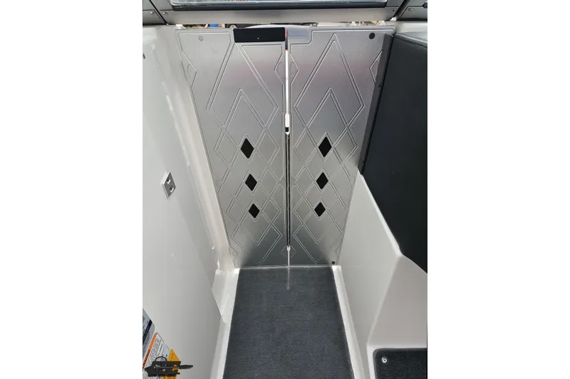 Slide: The Image of Interior view of a 2013 MasterCraft X-10 boat with geometric panel design. - 73