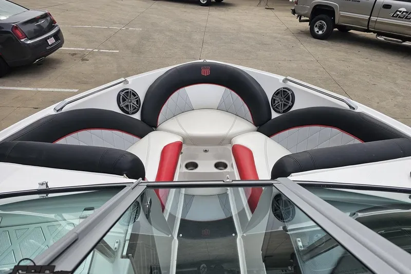 Slide: The Image of 2013 MasterCraft X-10 boat interior with stylish seating and speakers. - 74