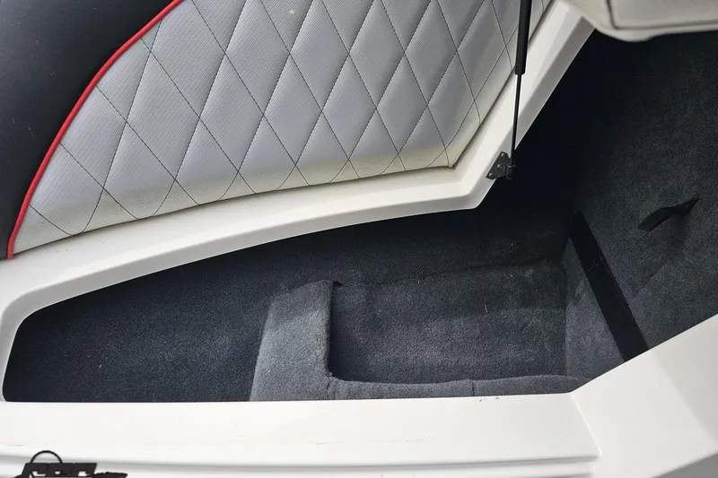 Slide: The Image of 2013 MasterCraft X-10 boat interior storage compartment with quilted upholstery. - 78