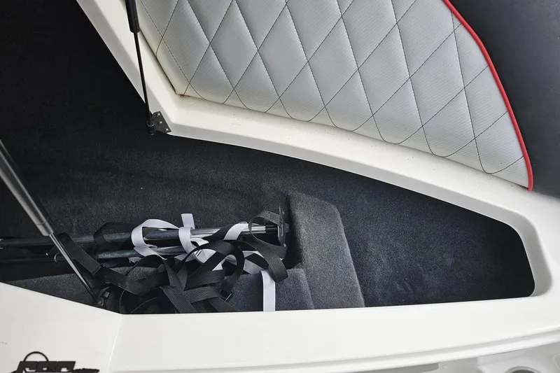 Slide: The Image of 2013 MasterCraft X-10 boat interior storage with quilted upholstery and straps. - 80