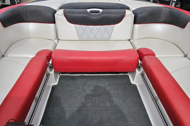 Slide: The Image of 2013 MasterCraft X-10 boat interior with red and white seating, diamond pattern accents. - 92