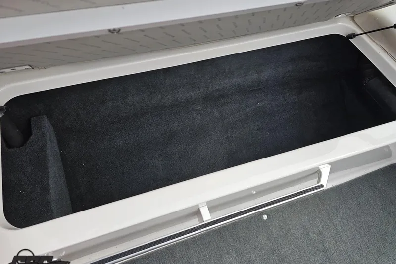 Slide: The Image of Open storage compartment in 2013 MasterCraft X-10 boat, featuring spacious interior. - 98