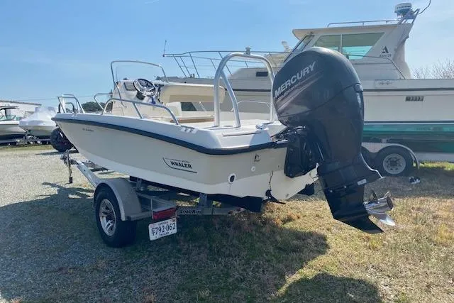 Slide: The Image of 2017 Boston Whaler 180 Dauntless boat with Mercury outboard engine on trailer. - 5
