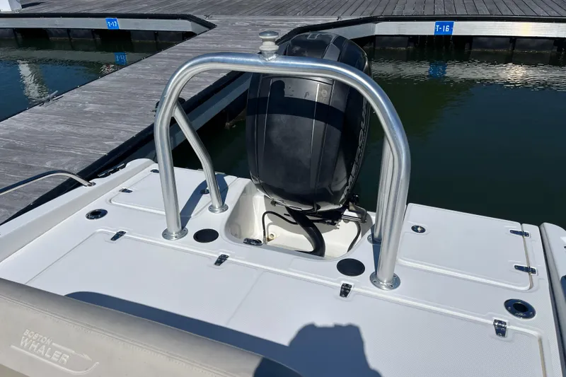 Slide: The Image of 2017 Boston Whaler 180 Dauntless boat with outboard motor at dock. - 8