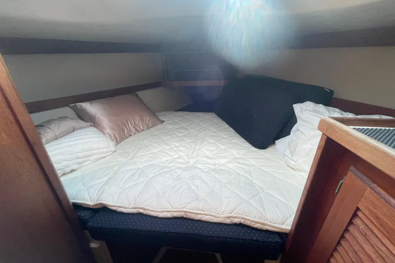 Slide: The Image of Cozy cabin interior of 1989 Catalina 36 sailboat with comfortable bedding. - 16