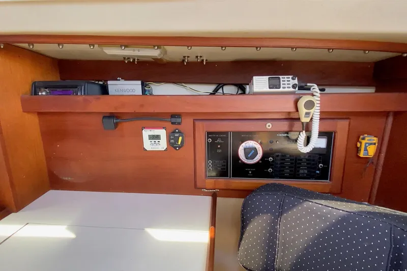 Slide: The Image of Interior of a 1989 Catalina 36 sailboat with navigation equipment and control panel. - 22