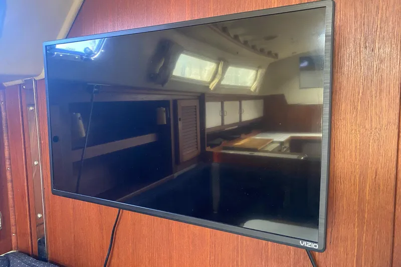 Slide: The Image of Flat-screen TV mounted inside a 1989 Catalina 36 sailboat cabin. - 23