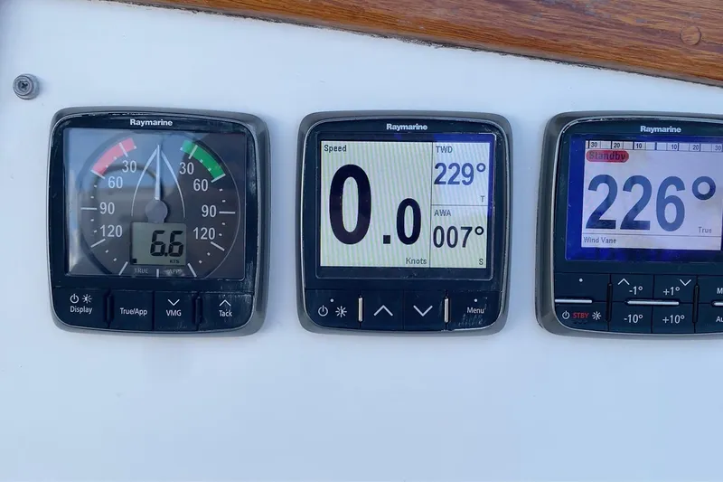 Slide: The Image of Raymarine navigation instruments on a 1989 Catalina 36 sailboat dashboard. - 31