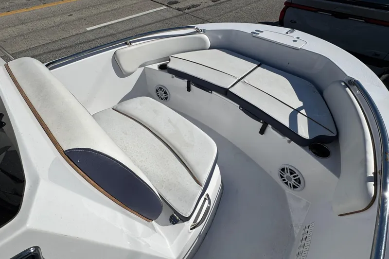 Slide: The Image of 2025 Stingray 173 CC boat interior with cushioned seating and speakers. - 11