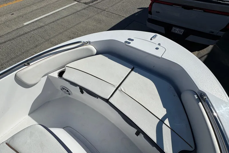 Slide: The Image of 2025 Stingray 173 CC boat interior with cushioned seating and storage compartments. - 14