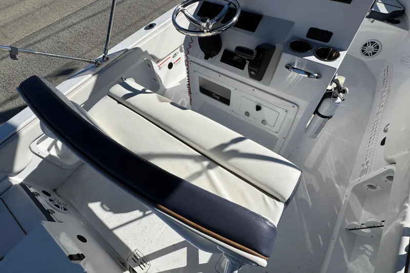 Slide: The Image of 2025 Stingray 173 CC boat interior with steering console and cushioned seating. - 3