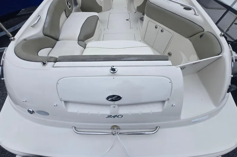 Slide: The Image of 2007 Sea Ray 240 Sundeck boat interior with seating and storage compartments. - 7