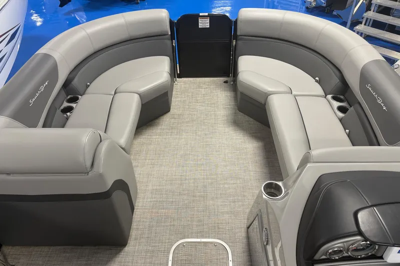 Slide: The Image of Interior of 2022 South Bay 224 RS 3.0 pontoon boat with gray seating and cup holders. - 6